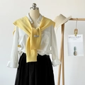 Pale yellow knitted shawl wrap with hollow patterns over a white cotton shirt - Yellow