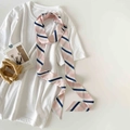 Detailed view of a pink and navy striped narrow scarf on a white basic t-shirt - Nude Pink Striped (P9002-Nude Pink)