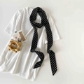 Detailed view of polka dot silk scarf tied on a white shirt neck for a chic look - Black Small Polka Dot (P9006-Black Small)