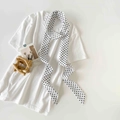 Detailed close-up of white silk scarf with black polka dots paired with cotton t-shirt - White Small Polka Dot (P9006-White Small)