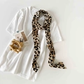 Flat lay of a leopard print satin skinny scarf paired with a white casual t-shirt - Khaki Leopard Print (P9004-Khaki Leopard)