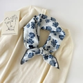 Detail of floral cotton neckerchief with black crochet lace trim on a knit sweater - 70cmx70cm / Sunflower White