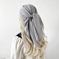 Close-up showing the elegant knot detail and drape of the grey chiffon square headscarf - Light Gray