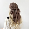 Detail view of dark brown chiffon scarf draped on model showing texture and transparency - Light Coffee