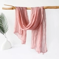 Detailed close-up of dusty rose jersey scarf with fine pleated texture and hemmed edges - 180x70cm / Pink