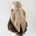 Detail of beige paisley silk scarf tied as a bohemian headband on a mannequin - 90x90cm / Khaki