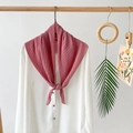 Detailed view of a pink pleated chiffon scarf styled on a white shirt with elegant draping - Rose Pink