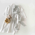 Polka dot skinny silk scarf in white with black dots paired with a white t-shirt - White Polka Dot (P9001-White)