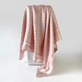 Detailed close-up of light pink satin scarf with Greek key pattern on white pedestal - Light Pink