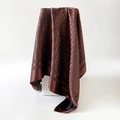 Detailed view of dark brown silk square scarf featuring classic Greek Key geometric patterns - Brown