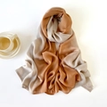 Detail shot of lightweight gradient chiffon shawl with rolled edges next to a coffee cup - 180x90cm / White Orange Gradient