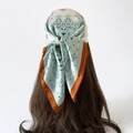 Close-up of mint green and brown paisley silk square scarf worn as a stylish headscarf - L7014 / Coffee Edge