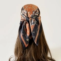 Close-up of vintage orange and black paisley silk square scarf worn as a stylish headscarf - L7315-70x70cm / Black