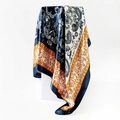 Detail of 90cm paisley silk scarf showing elegant drape and navy yellow floral patterns - 90x90cm / Navy & Yellow (D9017)