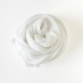 Solid white cotton linen scarf featuring long tassel fringe in a soft rose shape - White