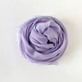 Solid lavender cotton linen scarf with soft fringe edges shown in circular wrap style - Light Purple