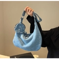 Detail of light blue denim hobo bag with a matching round coin purse and wide strap - Light Blue