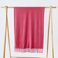 Solid rose pink scarf with tassels hanging on a wooden hanger against a white background - Watermelon Red (DW010-3)