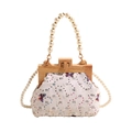 Vintage shell bag with butterfly sequins, wooden frame, and elegant pearl straps - White