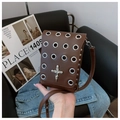Detailed view of punk style dark brown leather crossbody bag with skull cross pendant - Cross Style / Brown