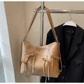 Detail of brown PU leather shoulder bag with bow ties, woven strips and silver metal rivets - Khaki