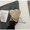Detail of heart-shaped beige PU bag with large silver bead handle and chain strap - Off White