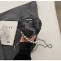 Detail of heart-shaped denim bag with silver bead handle and chain shoulder strap - Black