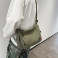Army green canvas messenger bag for men in utilitarian style with side pocket - Green
