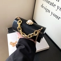 Glossy black acrylic cylinder evening bag with pearl clasp and golden chain strap - Black
