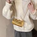 Golden acrylic cylindrical evening bag with pearl clasp and chain strap accessory - Gold