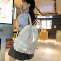 Student backpack in iridescent white laser fabric with large capacity side straps - White