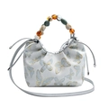 Sac à main papillon blanc argenté avec poignée en perles et bandoulière en cuir - Argent