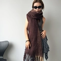 Detail view of thick dark brown mohair scarf with long tassels and soft knit texture - Brown