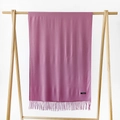 Detailed close-up of dark pink cashmere scarf with soft fringe and fabric label - Dusky Pink / 215*70cm
