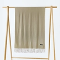 Detail of soft beige cashmere scarf featuring elegant fringe and woven material label - Khaki / 215*70cm