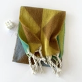 Detail of geometric mohair scarf featuring soft tassels and warm multi-color block patterns - Yellow Coffee Green