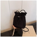 Minimalist black nylon drawstring bucket bag with adjustable shoulder strap for women - Black