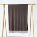 Detailed view of coffee brown cashmere scarf with fringe and label on wooden hanger - Shrimp Color / 215*70cm