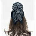 Detail of black paisley headscarf with white mandala patterns tied on a mannequin - Solid Black Mandala (RZ7078)