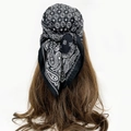 Detailed back view of a classic black and white paisley bandana tied on long curly hair - Black White Paisley (RZ6558)