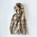 Detailed view of beige and blue plaid mohair scarf with thick brushed texture and long fringe - Coffee Blue