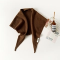 Detail view of the 100% wool knit scarf label with elegant brown texture - Coffee