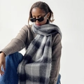 Close-up of thick plaid mohair scarf with fluffy texture and grey checkerboard pattern - Black & White Check