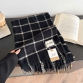 Classic black and white checkered scarf with soft tassels for winter warmth and style - Black