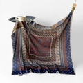 Large square silk scarf featuring red paisley print and navy blue floral borders - Silk Road Chapter