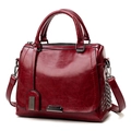 Retro burgundy tote bag in shiny oil leather with side studs and top handles - Burgundy