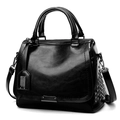 Classic black oil leather tote bag with silver rivets and adjustable crossbody strap - Black
