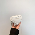 Mini heart-shaped white PU leather crossbody bag with golden text and silver chain - White