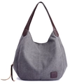 Minimalistische grijze canvas hobo tas met donkerbruine lederen riemen en diverse vakken - Grijs