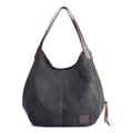 Minimalistische zwarte canvas hobo tas met bruine lederen handvatten en vintage textuur - Zwart